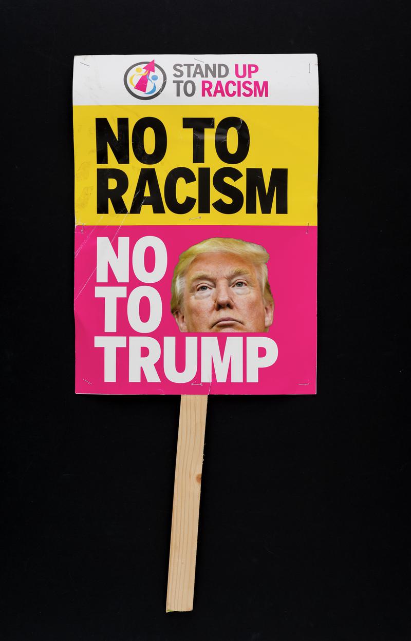 No to Racism. No to Trump&#039; placard used at the Anti-Trump protest in Cardiff city centre on 20 February 2018 - the day Parliament debates the state visit of US President Donald Trump. (Obverse)