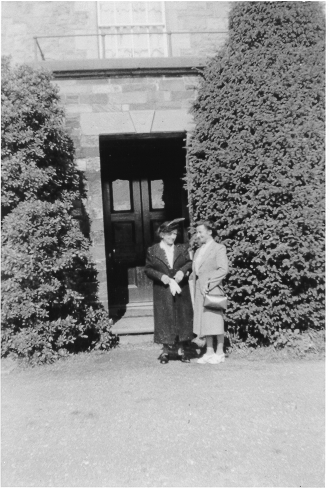 Dinorwig Quarry Hospital. Clemontine de Wulf (Vivian Hughes&#039; grandmother) and Mariette (Vivian Hughes&#039; cousin) outside the main entrance porch (with balcony above) to DQH. Note that the porch and balcony no longer exists.