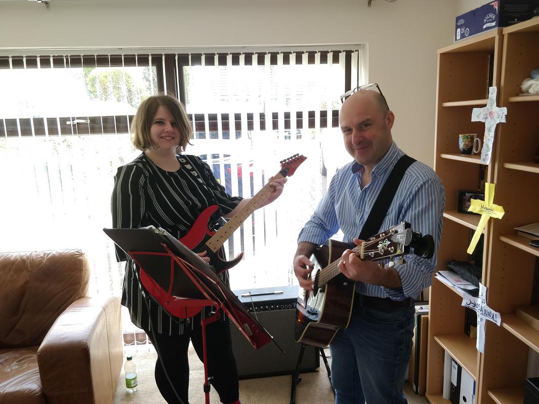 Ariane and Dr Philip Brumwell getting ready to lead worship that morning.
