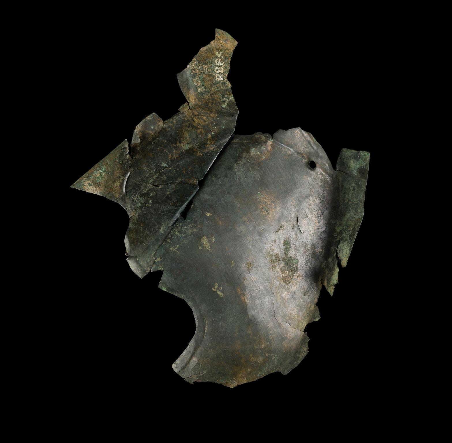 Roman copper alloy cheekpiece from helmet