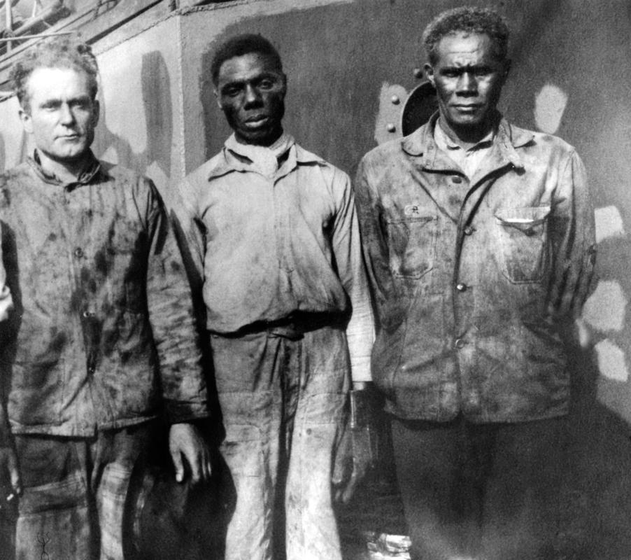 Two black and one white firemen on board a Radcliffe Steamer at Cardiff during Second World War