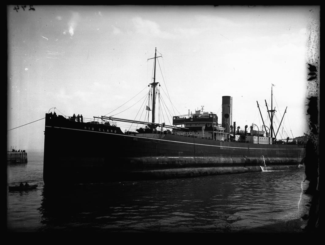 Port broadside view of S.S. RIO CLARO and waterman&#039;s boat at Cardiff docks, c.1936.