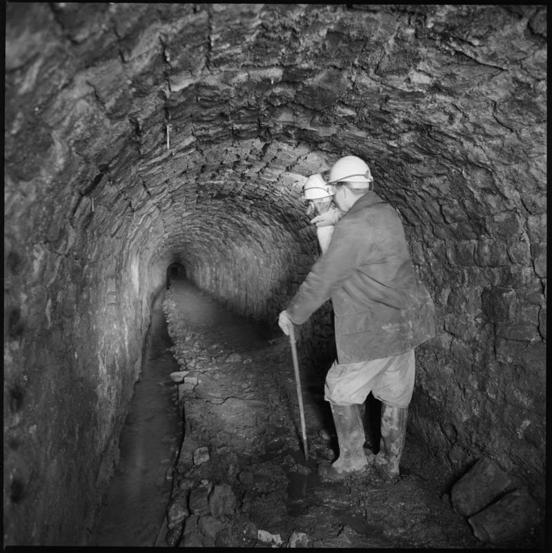 Black and white film negative showing man at River Arch, Big Pit Colliery.  &#039;Big Pit Blaenavon&#039; is transcribed from original negative bag.