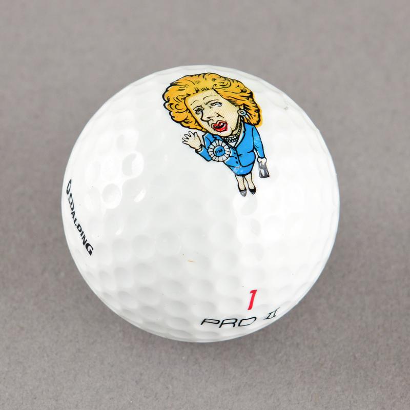 Golf ball with caricature of Margaret Thatcher. Sold during 1984-85 Miners&#039; Strike.