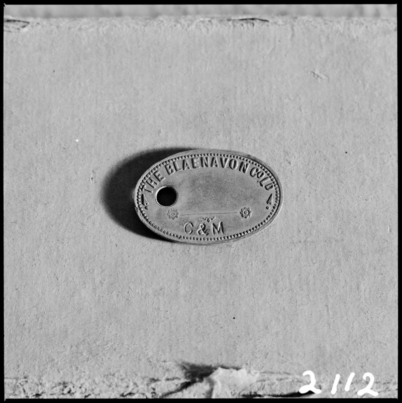 Black and white film negative showing a Blaenavon Co. Ltd. lamp check.  &#039;Blaenavon check&#039; is transcribed from original negative bag.