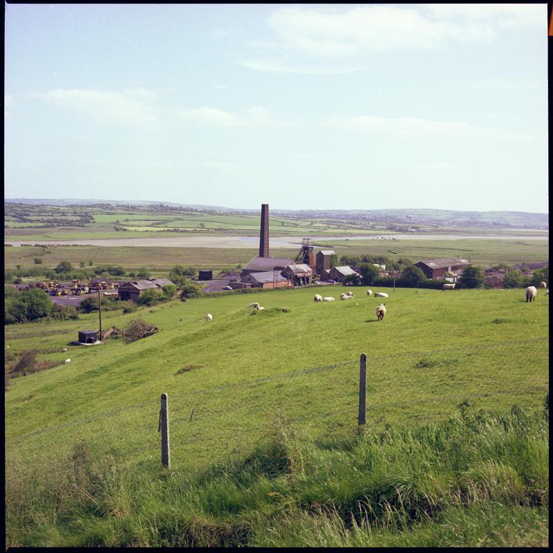 Colour film negative showing a distant surface view of Morlais Colliery. &#039;Morlais&#039; is transcribed from original negative bag.