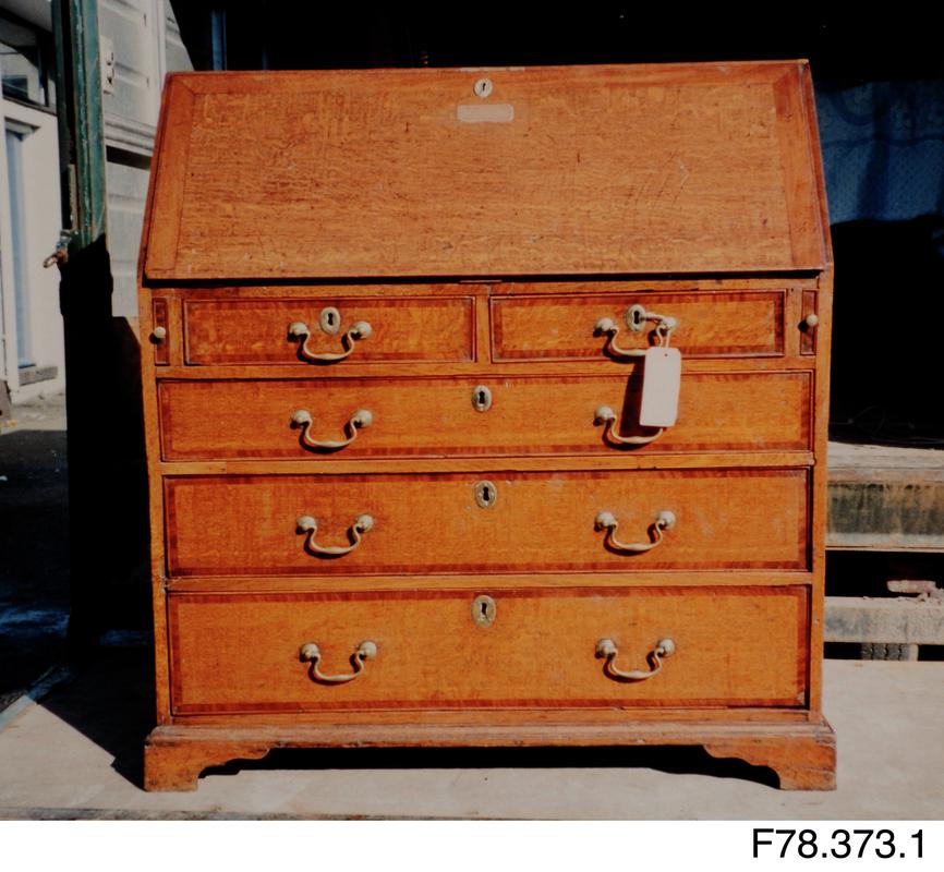 Bureau of oak, mahogany and brass