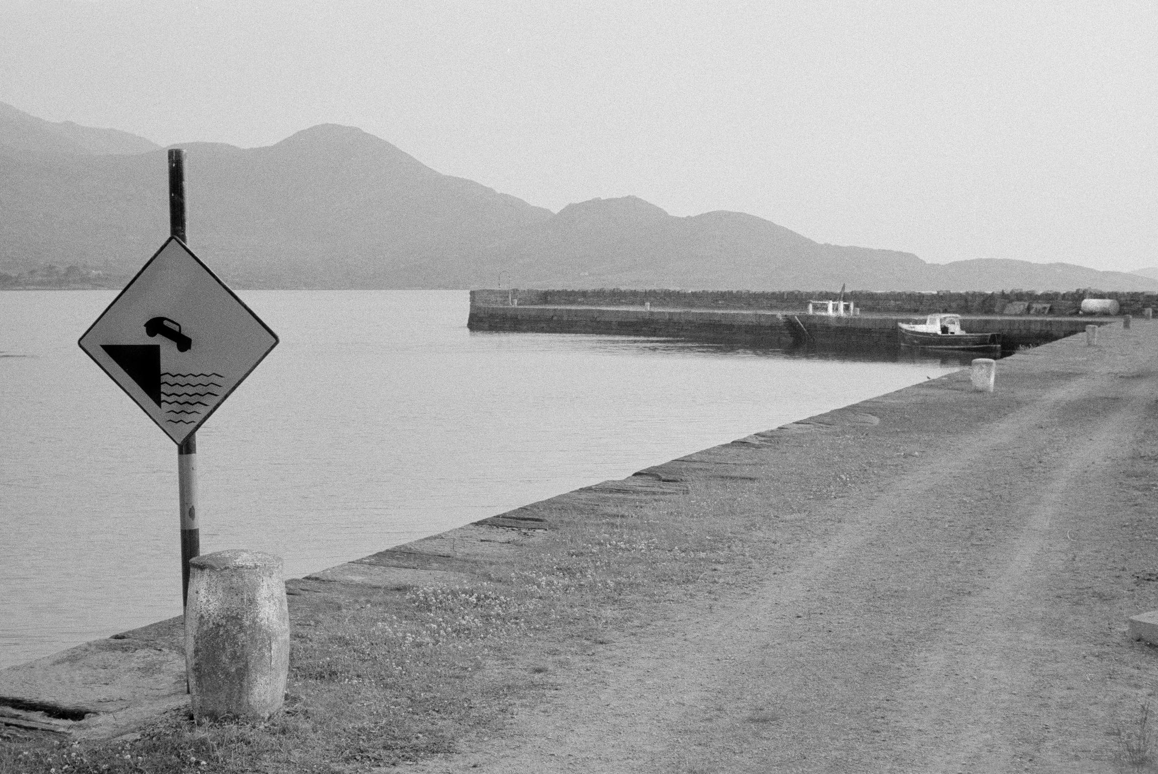 The sea front and danger sign. County Kerry. Kenmare. Ireland