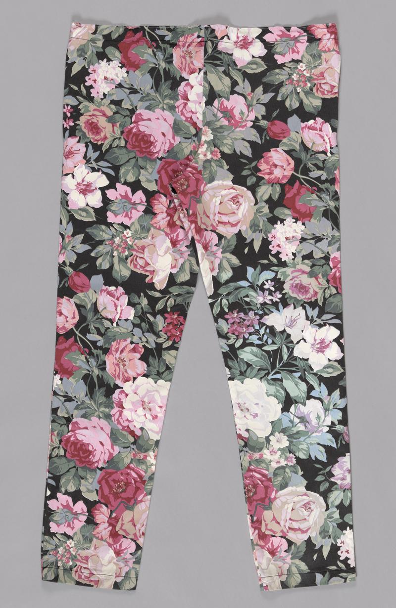 Pair of floral drawstring trousers, part of a two piece scrubs set. Made from printed cotton furnishing fabric, machine sewn.