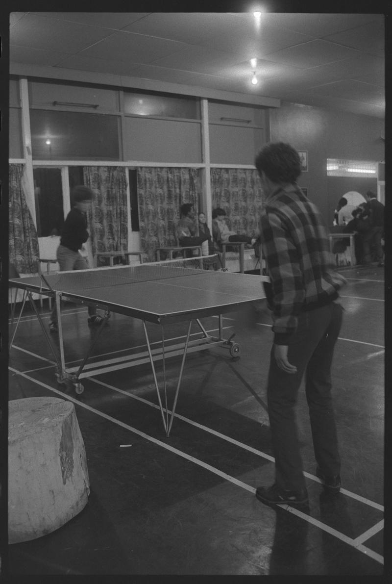 Teenagers playing table tennis at Butetown Youth Club.