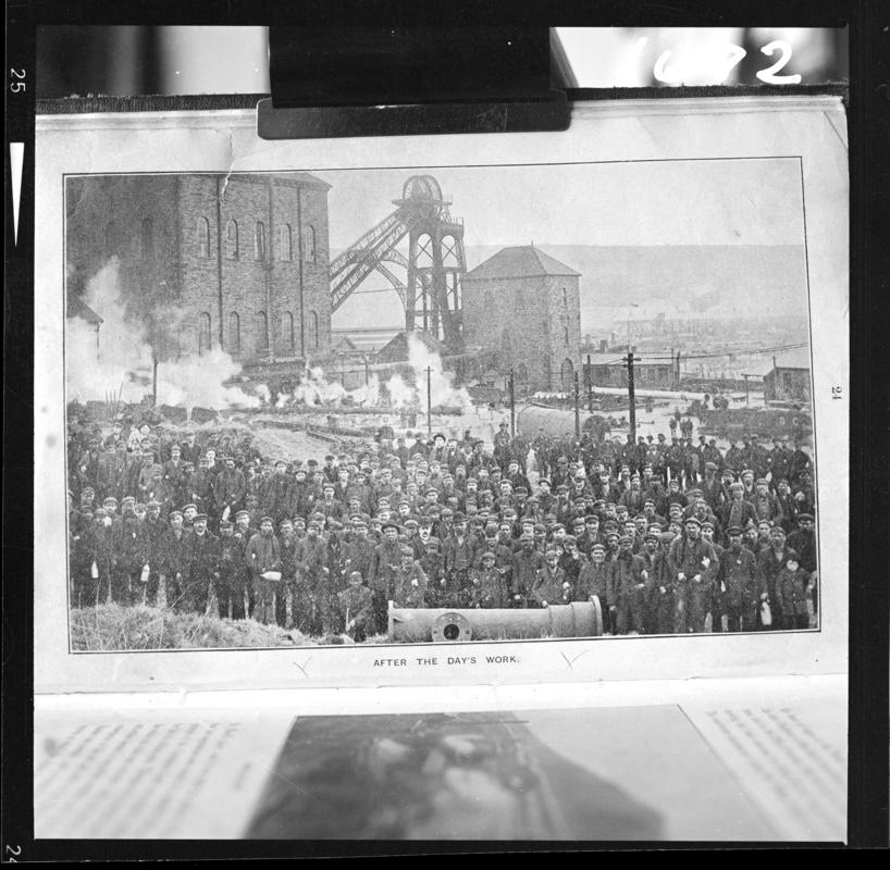 Black and white film negative of a photograph showing a large crowd of workmen &#039;after the day&#039;s work&#039;, Deep Navigation Colliery.