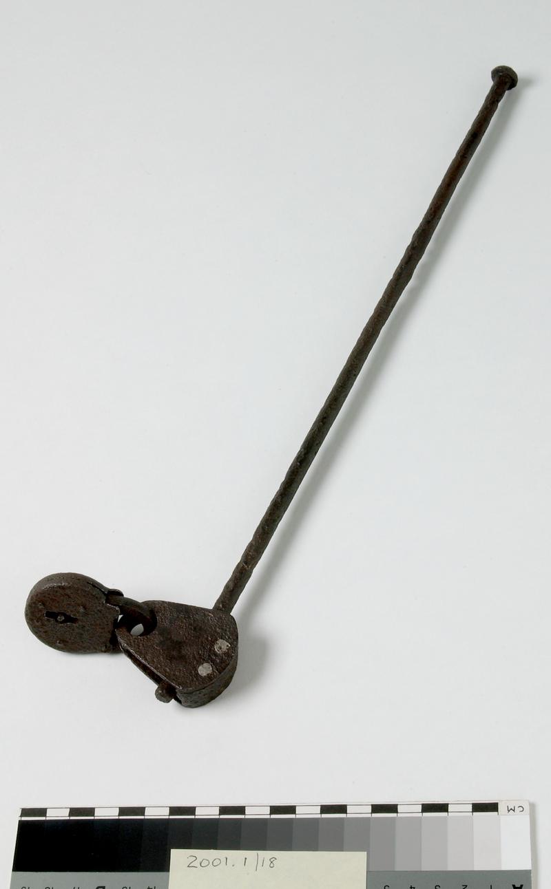 Metal tool bar with padlock attached.
