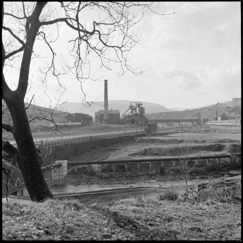 Black and white film negative showing a view towards Lewis Merthyr Colliery.  &#039;Lewis Merthyr&#039; is transcribed from original negative bag.