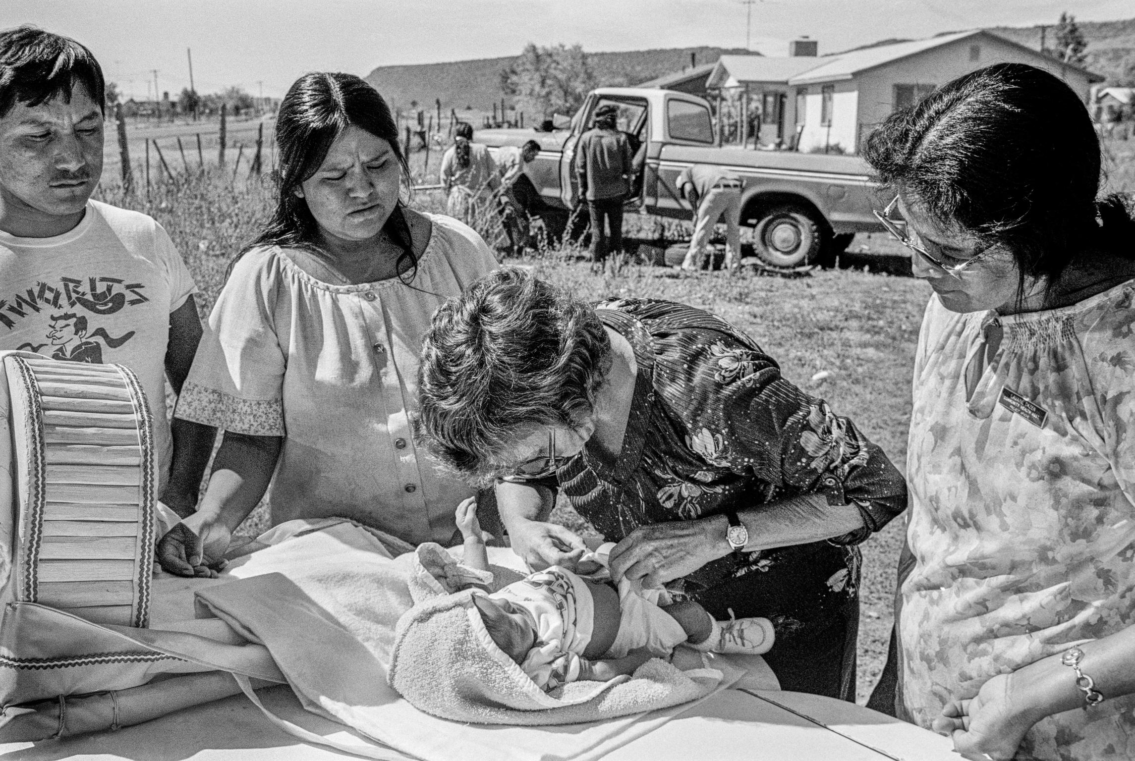 Apache reservation. Doctor from Phoenix hospital examining new born baby. Arizona USA