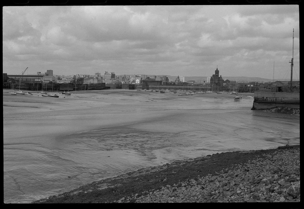 View across Cardiff Bay to the Welsh Industrial and Maritime Museum, the Pier Head Building and Dry Docks, from west side of Queen Alexandra Dock.