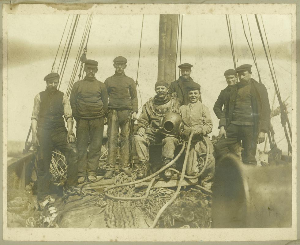 Group of divers on board a small vessel