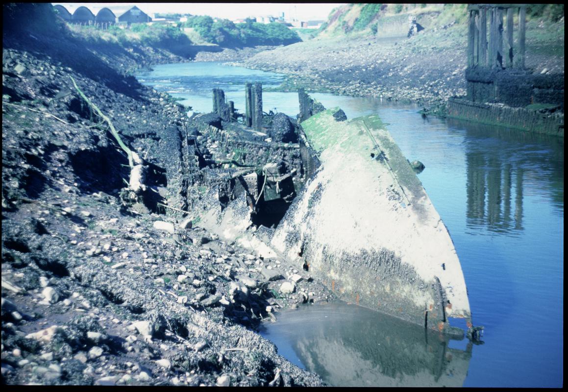 Remains of an iron or steel vessel beneath the west pier of  the New Cut Draw Bridge, 1987.