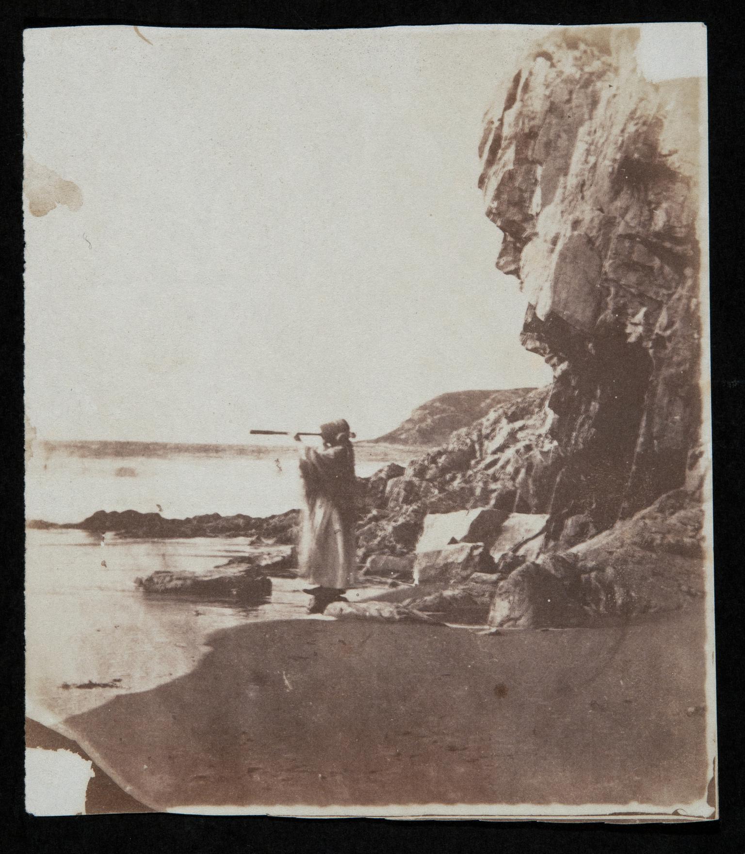 Thereza at Caswell Bay with telescope, photograph