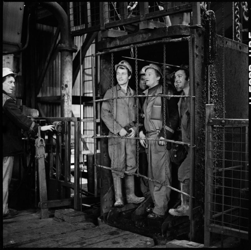 Black and white film negative showing men in the cage at pit top, Coegnant Colliery 25 November 1981.  &#039;Coegnant 25 Nov 1981&#039; is transcribed from original negative bag.