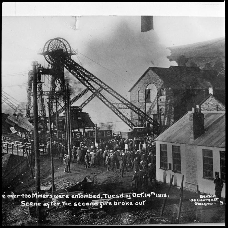 Black and white film negative of a photograph showing the scene at Universal Colliery, Senghenydd after the explosion of 14 October 1913.  Caption on photograph reads &#039;the Welsh Pit disaster where over 400 miners were entombed, Tuesday October 14th 1913.  Scene after the second fire broke out&#039;.   &#039;Senghenydd&#039; is transcribed from original negative bag.