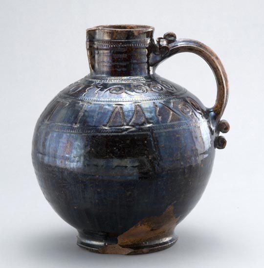 Incised earthenware harvest jug, made in Gestingthorpe, Suffolk, in 1680. Purchased 1904. 