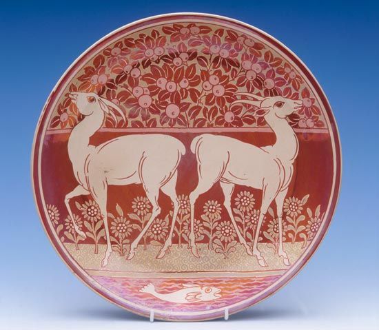 Earthenware dish painted in red and gold lustre by William de Morgan