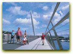 A famliy walking over Sail bridge