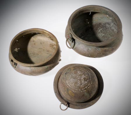 The hoard group of two bowls and a wine-strainer