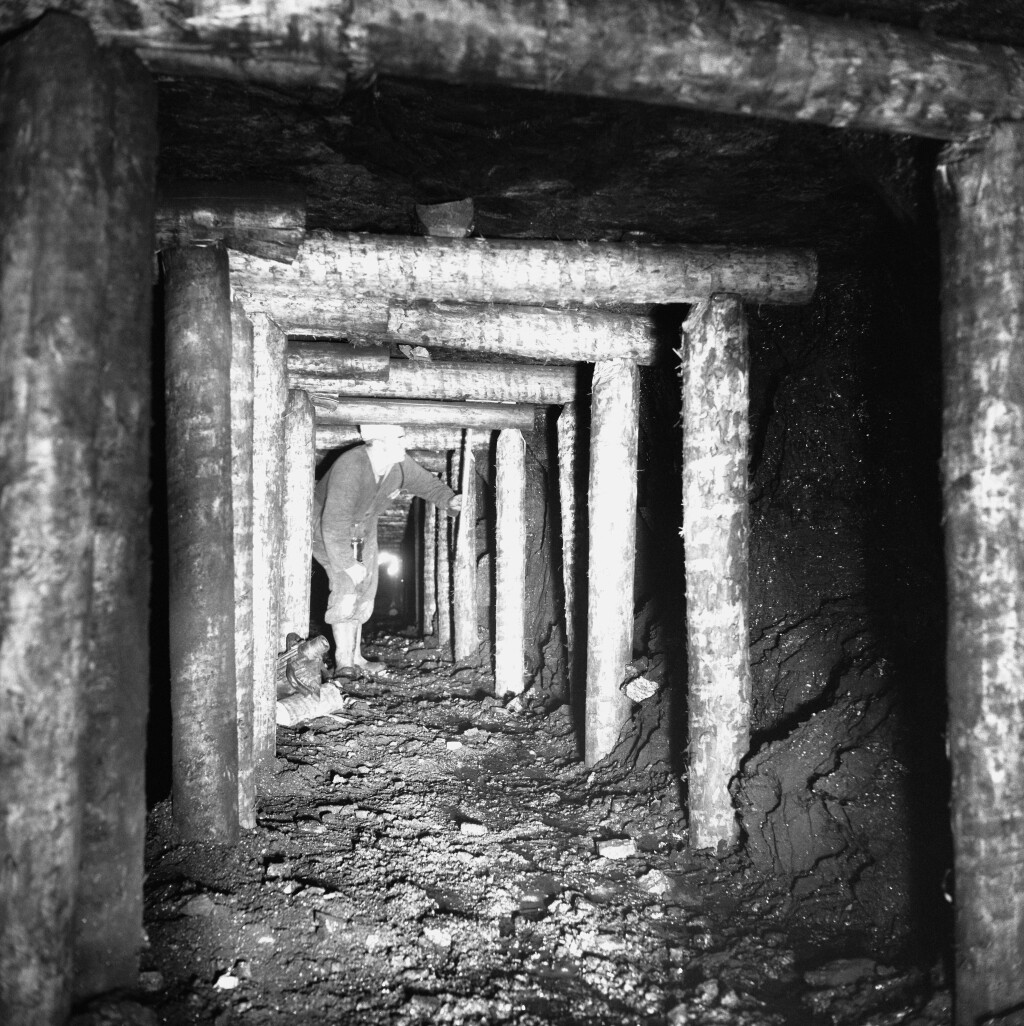 Ammanford Colliery, 1974, Mr P.A. Jones, Safety Officer inspecting the roof on the last coal face.