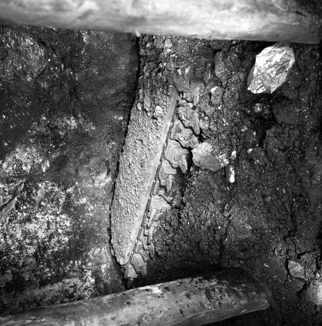 Fernhill Colliery, the jib of an AB 15 hydraulic undercutter on a timbered longwall face.