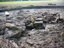 The walling around the spring head in Evan's trench.