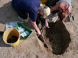 More of the burial exposed.