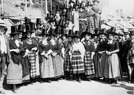 Women in Welsh dress greeting visitors, 30th August, 1909