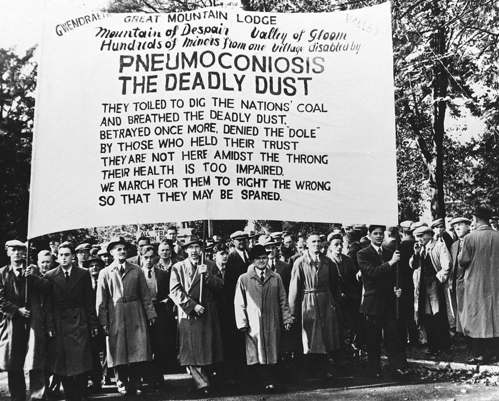 Pneumoconiosis banner in NUM march, 1952 (b/w photo)