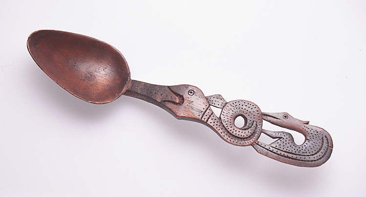 Lovespoon, with handle carved to depict serpent and bird