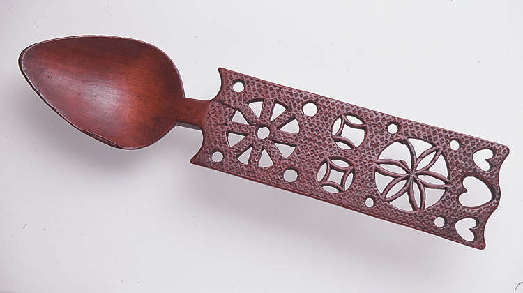 Lovespoon, with panel handle and covered with chip-carving