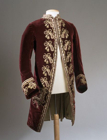 Velvet coat embroidered with silks and gold sequins.