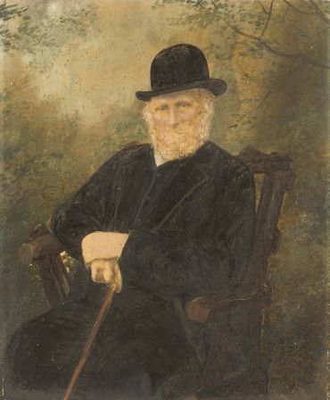 Portrait of seated Man wearing a Hat