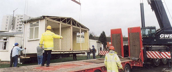 The Historical Buildings Unit dismantling the prefab at Llandinam Crescent in November 1998.