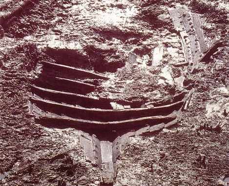 The remains of the boat in the mud
