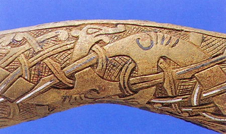 Detail of an animal in profile depicted on one side of the Smalls sword guard.