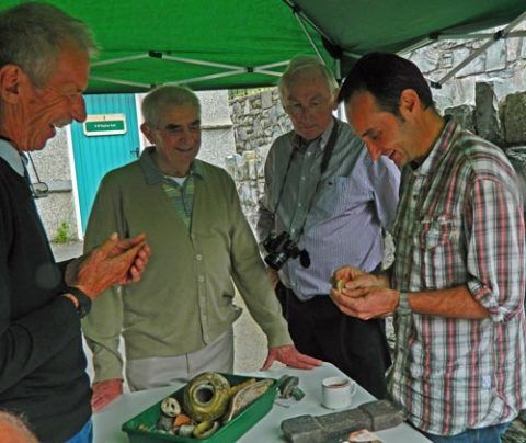 PAS Cymru Finds Co-ordinator conducting a find identification day at Penmaenmawr, Conwy