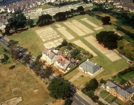 Aerial view of Segontium showing the playing-card shape that is typical of Roman forts. Many of its stone buildings have been exposed for public display. Image: Cadw (Crown Copyright).