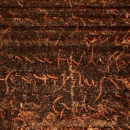 Detail of the tablet revealing the Roman writing preserved on its surface.