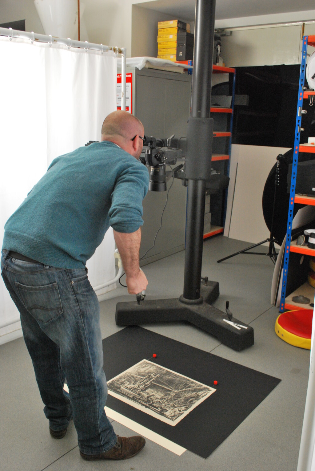 Here you can see our colleague Robin Maggs taking photographs about the prints in the studio. 