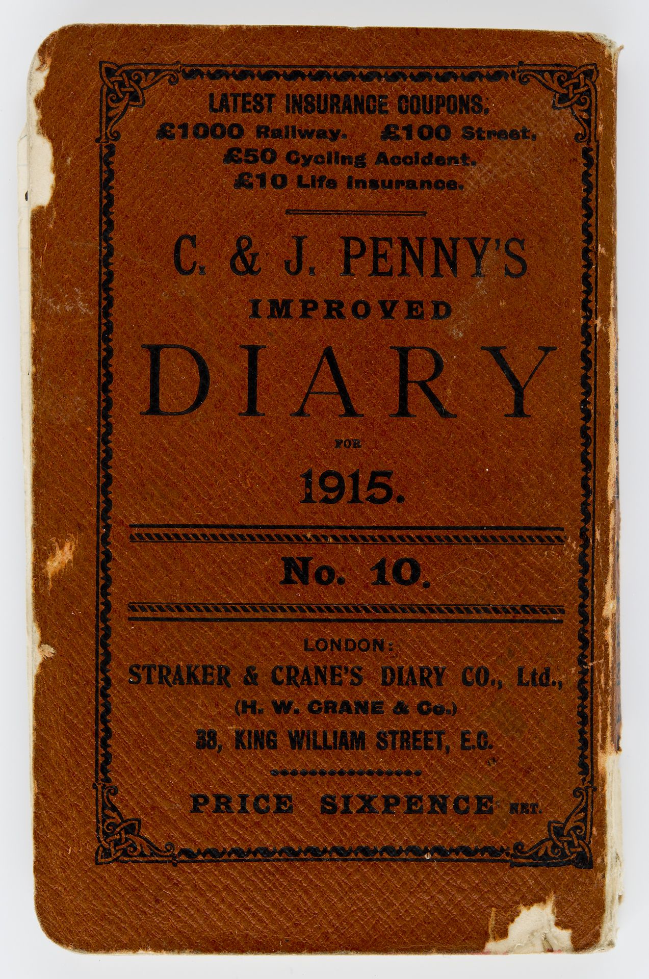Diary with a red cover and the words C. & J. PENNY’S IMPROVED DIARY FOR 1915 in black ink
