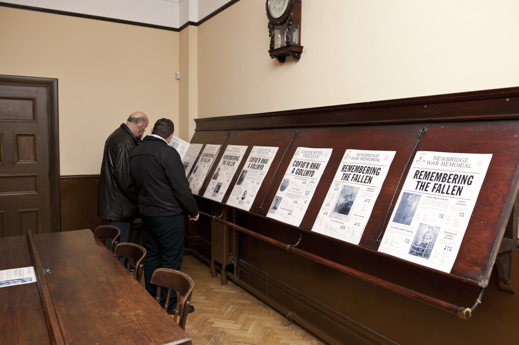 Replica broadsheet newspapers displayed on stands in the Reading Room of Oakdale Institute. 