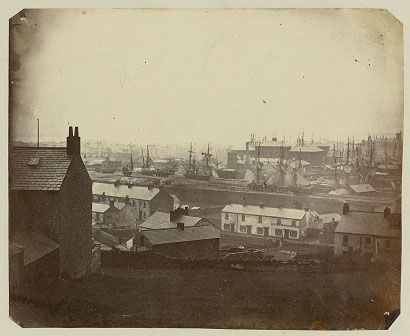 This photograph was made using the Oxymel process. It was taken on 15 March 1858 at 1pm with an exposure of 15 minutes. It shows Swansea from St. Thomas, and sailing vessels can be seen in the background.