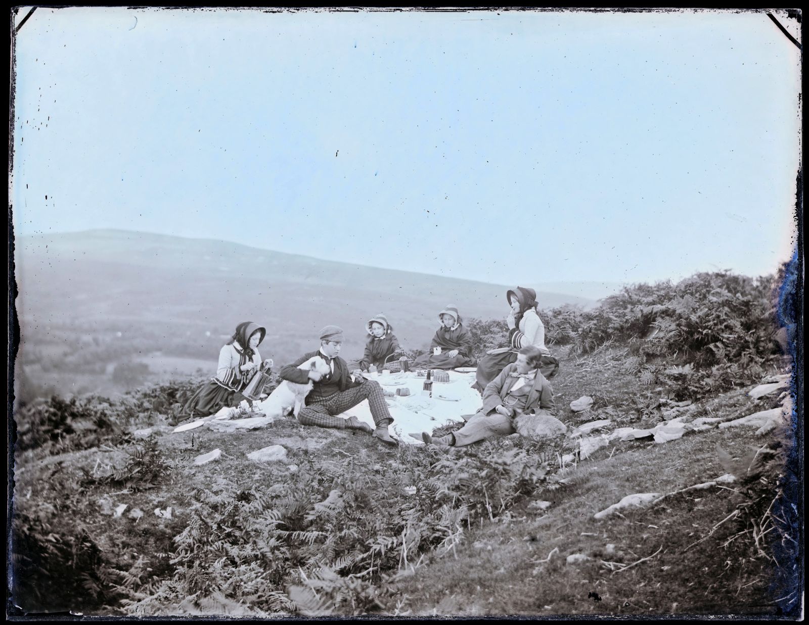 This photographs shows the Llewelyn children having a picnic on the Goppa near Swansea in 1855. It is one of a series of photographs of the children taken by John on the 23rd September each year for his wife’s birthday.