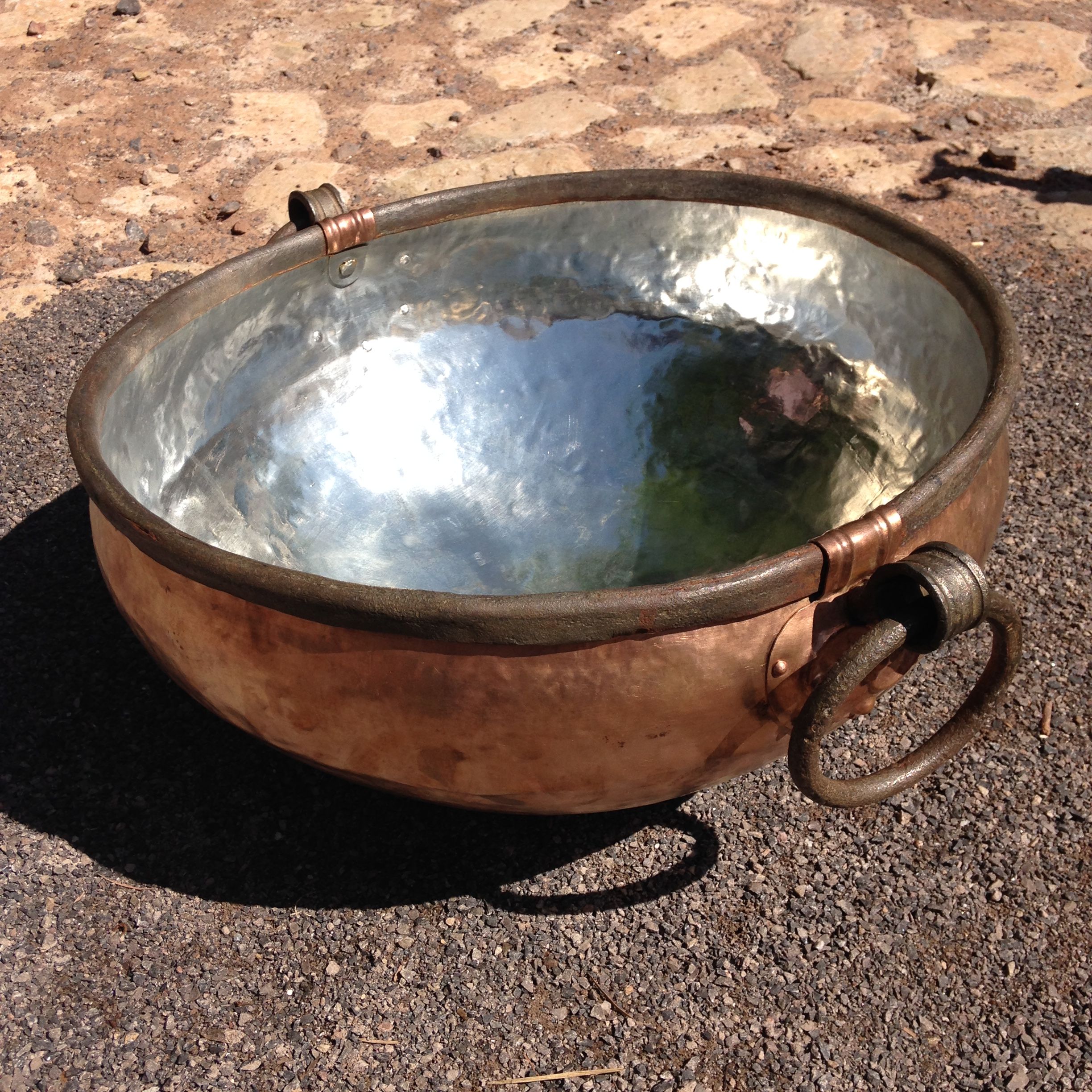 A close-up of the copper cauldron